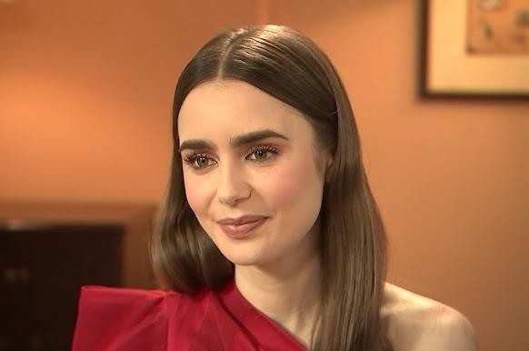 Lily Collins w dynamicznej, profesjonalnej scenie z jednego z jej filmów, ukazująca jej aktorski talent.